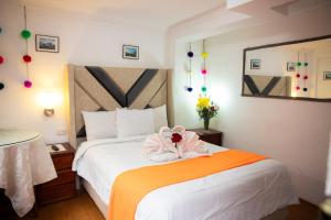 Voodi või voodid majutusasutuse Hostal Tu Hogar toas