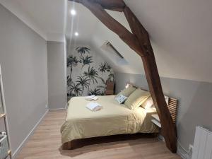 a bedroom with a bed with a wooden canopy at Maison de charme rénovée au cœur du Val de Loire avec parking et wifi inclus - FR-1-590-526 in Chaingy