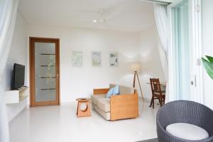 TV o dispositivi per l'intrattenimento presso Harmony Beach Suite