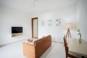 TV o dispositivi per l'intrattenimento presso Harmony Beach Suite