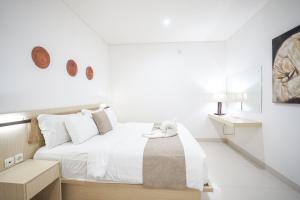 Letto o letti in una camera di Harmony Beach Suite