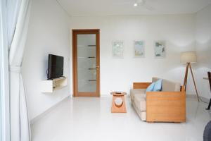 TV o dispositivi per l'intrattenimento presso Harmony Beach Suite