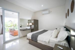 Letto o letti in una camera di Harmony Beach Suite