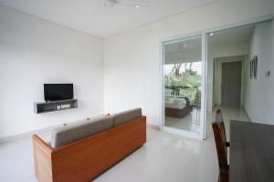 TV o dispositivi per l'intrattenimento presso Harmony Beach Suite