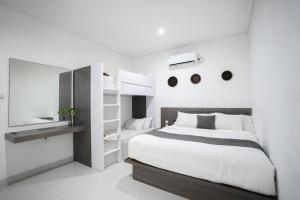 Postel nebo postele na pokoji v ubytování Harmony Beach Suite + 37 fotografií