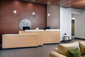 a lobby with a reception desk and chairs at Fairfield Inn & Suites by Marriott Asheville Airport/Fletcher in Fletcher +15 photos