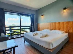 Postel nebo postele na pokoji v ubytování Zea Zide Hotel