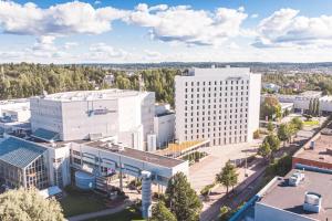 an overhead view of a city with tall buildings at Courtyard Tampere City in Tampere