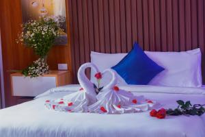 Postel nebo postele na pokoji v ubytování Sapa Grand Blue Hotel