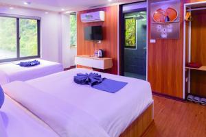 Postel nebo postele na pokoji v ubytování Sapa Grand Blue Hotel