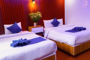 Postel nebo postele na pokoji v ubytování Sapa Grand Blue Hotel