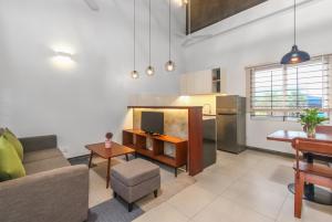 a living room with a couch and a table at Phan NaTa Residence in Siem Reap