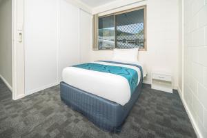 Letto o letti in una camera di Reef Gateway Hotel