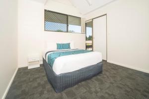 Letto o letti in una camera di Reef Gateway Hotel