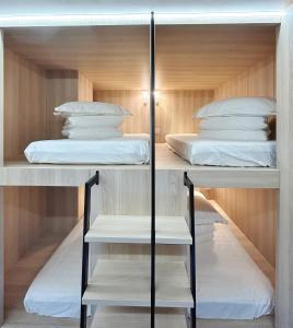 a bunk bed room with two beds in it at UNPLAN Hostel in Madrid +46 photos