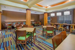 a dining room with tables and chairs in a room at Fairfield Inn & Suites Cookeville in Cookeville +11 photos
