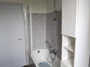 a bathroom with a shower and a bath tub at Gîte de charme avec jardin et loisirs en Meuse - FR-1-585-161 in Saudrupt +28 photos