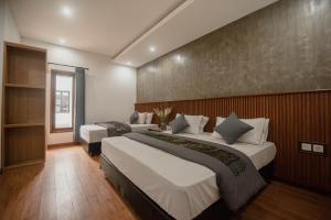 Postel nebo postele na pokoji v ubytování Sandat Hotel Legian