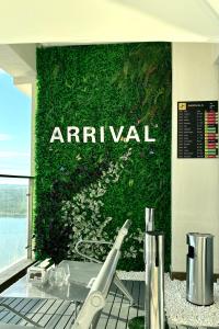 a green wall with the wordarmaarma on it at Dooga Ins-Boeing 777X Seaview in Johor Bahru