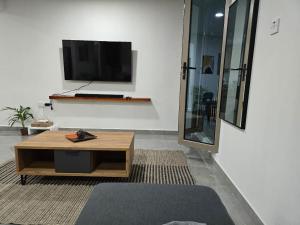 TV a/nebo společenská místnost v ubytování ocsoasis