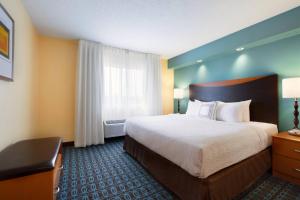 a hotel room with a large bed and a window at Country Inn & Suites by Radisson, Bismarck-Mandan in Bismarck +20 photos