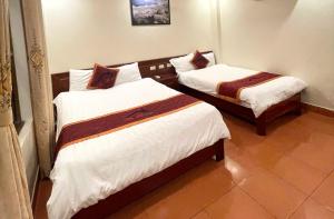 Postel nebo postele na pokoji v ubytování Son Ha Hotel SAPA