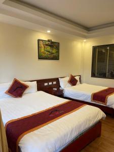 Postel nebo postele na pokoji v ubytování Son Ha Hotel SAPA