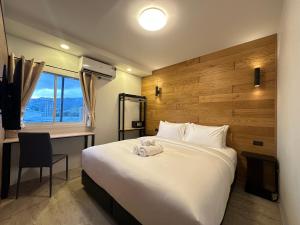 Ένα ή περισσότερα κρεβάτια σε δωμάτιο στο EbS Residence Chaweng