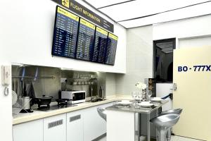 a kitchen with a counter with a microwave and acomputer at Dooga Ins-Boeing 777X Seaview in Johor Bahru +63 photos
