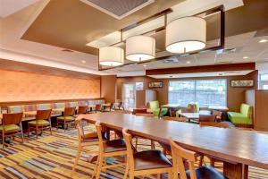 a conference room with a large wooden table and chairs at Fairfield Inn & Suites by Marriott Nashville Downtown-MetroCenter in Nashville +49 photos