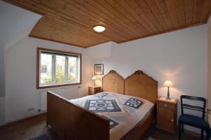 Ένα ή περισσότερα κρεβάτια σε δωμάτιο στο Ferienhaus Zaunkönig