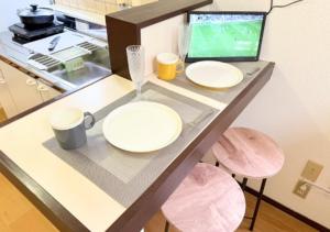 TV a/nebo společenská místnost v ubytování 高平ハウス Room203