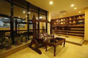 a living room with a couch and a coffee table at Hotel Arts Kathmandu in Kathmandu