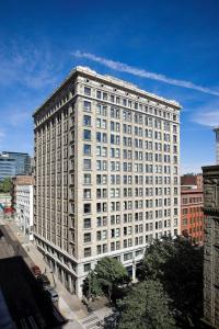 a large white building with many windows on a city street at Courtyard Seattle Downtown / Pioneer Square in Seattle