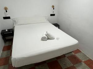 Postel nebo postele na pokoji v ubytování Lowcost Rooms