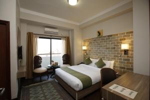Postel nebo postele na pokoji v ubytování Hotel Arts Kathmandu + 37 fotografií