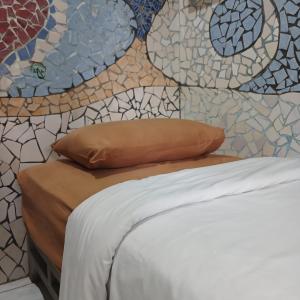 Postel nebo postele na pokoji v ubytování Pondok IJo Guesthouse