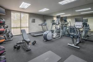 a gym with several treadmills and exercise bikes at Courtyard by Marriott Waldorf in Waldorf