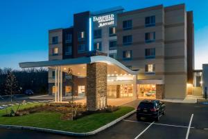 a hotel with a car parked in a parking lot at Fairfield Inn & Suites by Marriott Boston Marlborough/Apex Center in Marlborough