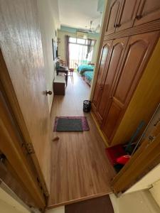 a hallway leading to a bedroom with a door at Studio Apartment KTC KB in Kota Bharu