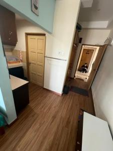 a kitchen with a refrigerator and a mirror at Studio Apartment KTC KB in Kota Bharu