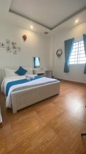 Postel nebo postele na pokoji v ubytování HUY HOANG II Hotel - Da Lat