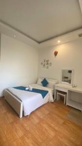 Postel nebo postele na pokoji v ubytování HUY HOANG II Hotel - Da Lat