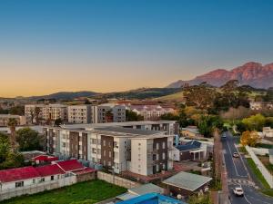 an aerial view of a city with mountains in the background at WINK Aparthotel Quiver Tree in Stellenbosch