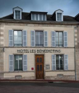 a building with the words hotel his brittties on it at Hotel Les Bénédictins in Limoges