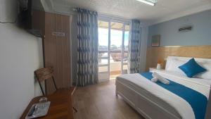 Postel nebo postele na pokoji v ubytování HUY HOANG II Hotel - Da Lat