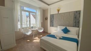 Postel nebo postele na pokoji v ubytování HUY HOANG II Hotel - Da Lat