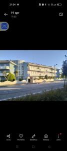 a picture of a building in front of a street at Esperia in Caorle