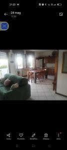 a living room with a couch and a dining room at Esperia in Caorle