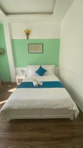 Postel nebo postele na pokoji v ubytování HUY HOANG II Hotel - Da Lat
